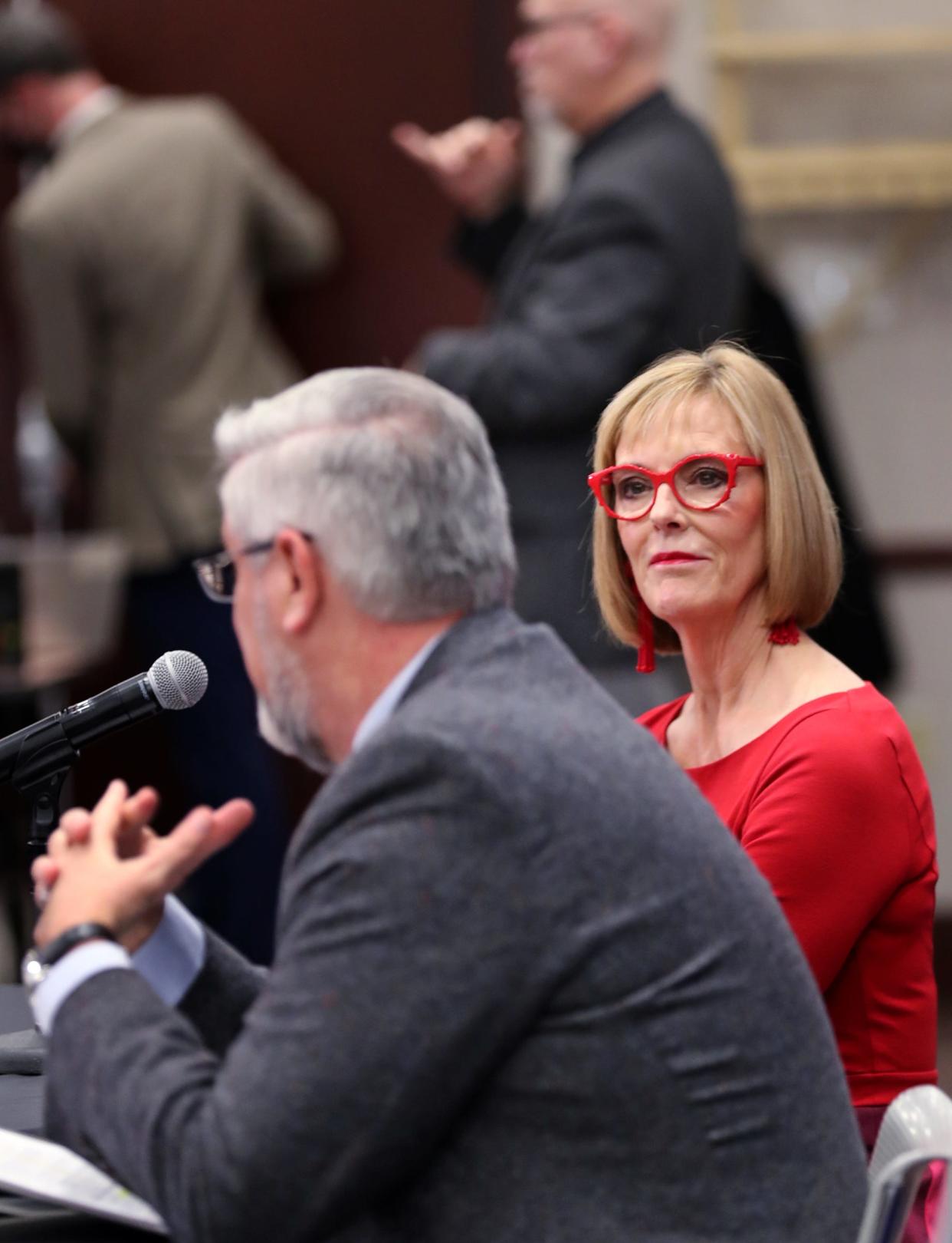 Lt. Gov. Suzanne Crouch, right, listens as Gov. Eric Holcomb speaks about his 2022 agenda Monday, Jan. 3, 2022 at the Indiana Government Center South in Indianapolis.