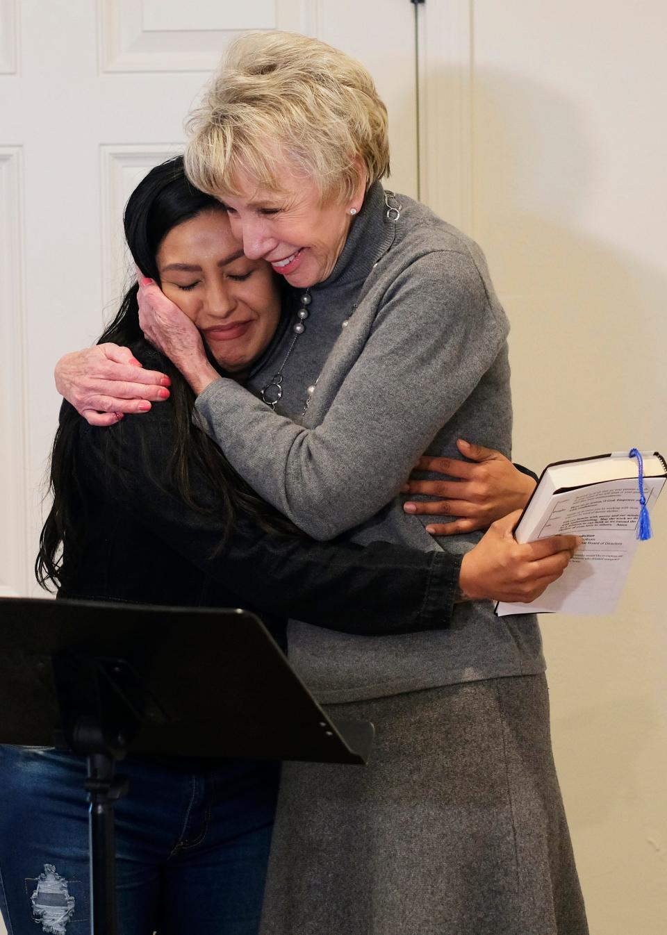 Ann Felton Gilliland, chairman and CEO of Central Oklahoma Habitat for Humanity, hugs new Habitat homeowner Ana Villalobos at the dedication of her home in the Stephen Florentz Legacy Estates addition.