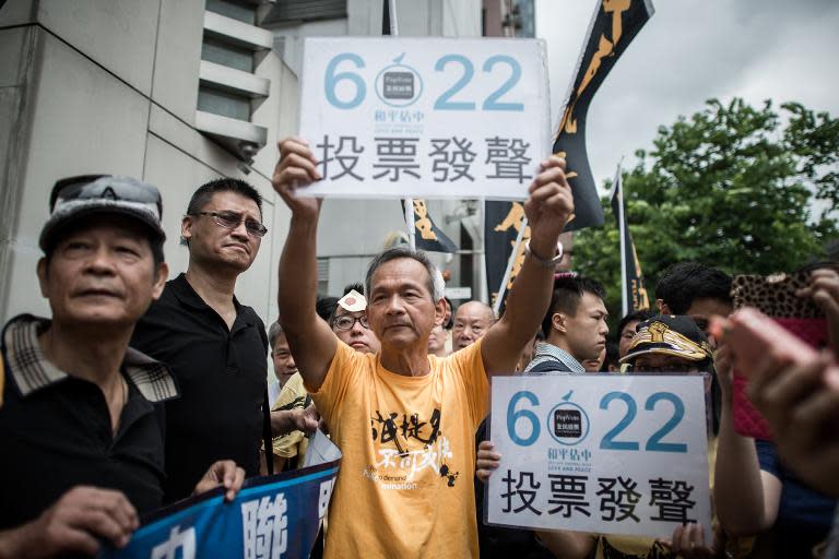 Occupy Central supporters protest outside Beijing's representative office in Hong Kong on June 11, 2014