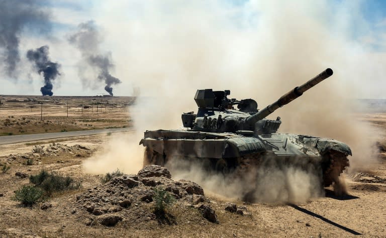 An Iraqi-modified T-72M tank belonging to the pro-government Hashed al-Shaabi paramilitary forces advances on April 26, 2017 towards the ancient city of Hatra, southwest of Mosul, during an offensive to retake the area from the Islamic State group