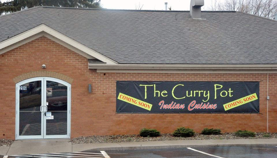 The sign by the entrance to the soon to be The Curry Pot, an Indian cuisine restaurant on Beall Avenue in Wooster.