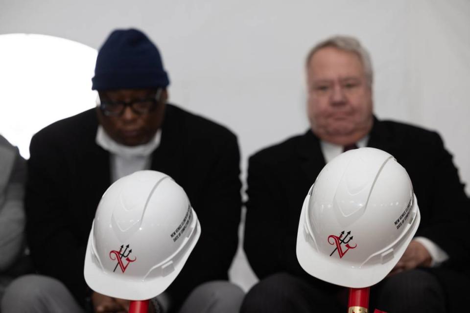 State Sen. Chris Belt, D-Swansea, and Rep. Jay Hoffman, D-Swansea, sit behind hard hats adorned with the Venice District 3 logo at the groundbreaking ceremony for the city’s new elementary school on Feb. 16, 2024, in Venice, Ill.