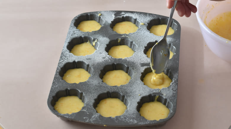 portioning batter into bundt pan