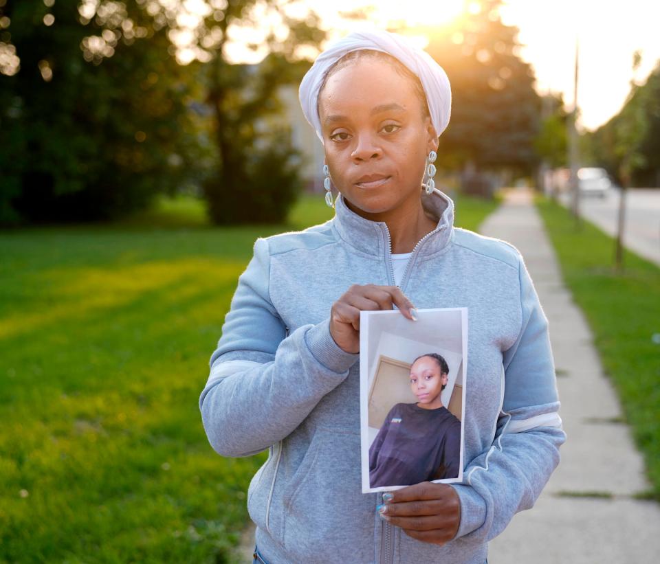 Tanesha Howard holds a photo of her 15-year-old daughter, Joniah Walker near her home in Milwaukee on Wednesday, Sept. 14, 2022. Howard last saw her daughter in the afternoon on June 23.