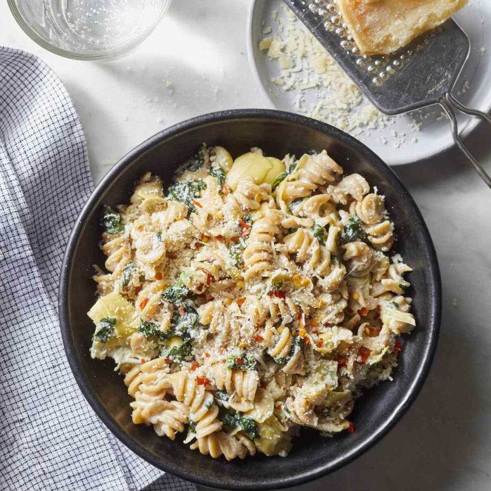 <p>If you've ever wanted to make a meal out of warm spinach and artichoke dip, this creamy pasta is for you. And here's what's almost as good as the flavor of this comforting dish: the fact that this healthy dinner takes just 20 minutes to prepare.</p> <p> <a href="https://www.eatingwell.com/recipe/276095/spinach-artichoke-dip-pasta/" rel="nofollow noopener" target="_blank" data-ylk="slk:View Recipe;elm:context_link;itc:0;sec:content-canvas" class="link ">View Recipe</a></p>