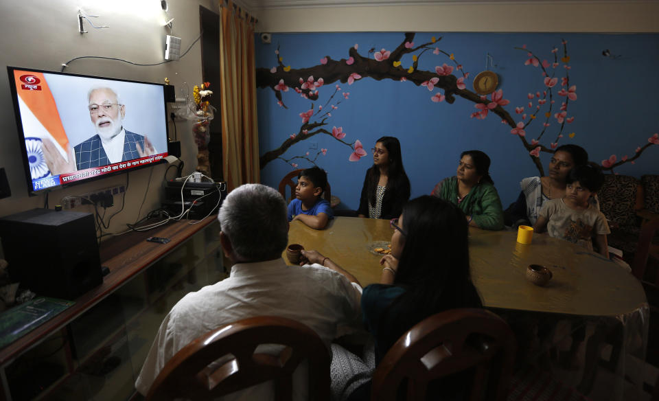 An Indian family watches prime minister Narendra Modi addressing the nation on a television, in Prayagraj, Uttar Pradesh state, India, Wednesday, March 27, 2019. India says it has successfully tested an anti-satellite weapon in an unexpected announcement just weeks before general elections. Indian Prime Minister Narendra Modi said in an address to the nation broadcast live on Wednesday that Indian scientists had earlier shot down a low earth orbit satellite with a missile, demonstrating India’s capacity as a “space power” alongside the U.S., Russia and China. (AP Photo/Rajesh Kumar Singh)