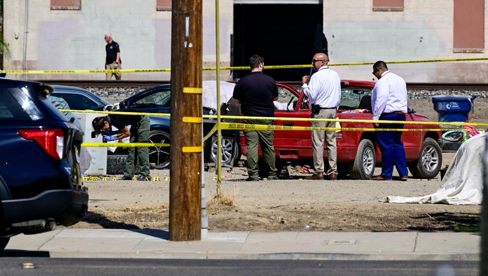Tulare County Sheriff Department officials investigate a shooting Tuesday, Aug. 16, 2022, involving two Tulare police officers near I Street and King Avenue.