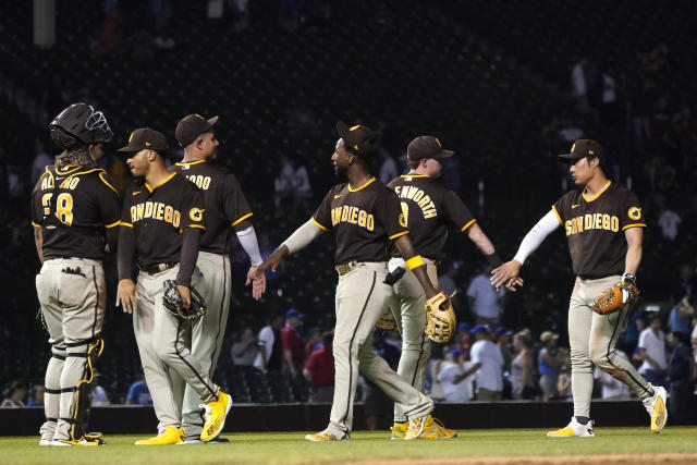 San Diego Padres' Luke Voit watches his three-run double off Chicago Cubs  relief pitcher Mychal Givens during the seventh inning of a baseball game  Tuesday, June 14, 2022, in Chicago. (AP Photo/Charles