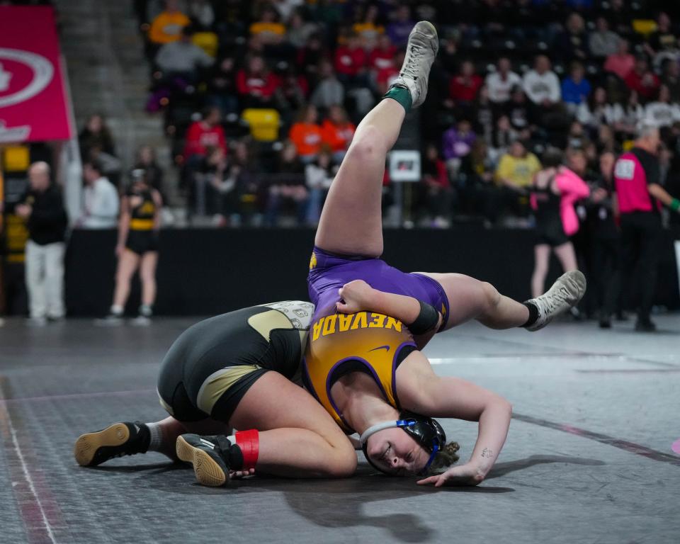 Glenwood’s Lauralyse Flint-Spencer wrestles Nevada’s Gracie Leslie at 130 pounds during the first round of consolation at the Iowa Girl’s state wrestling tournament starts at Stream Arena in Coralville, Iowa on Thursday, Feb. 2, 2023.