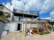 <p>Over in Llanelli, Wales, this five-bedroom home was crowned the most-viewed of the year so far. Set over four floors, it has outstanding views across the coastline, a cinema, gym, flexible living space, <a href="https://www.housebeautiful.com/uk/garden/g32185721/fire-pit/" rel="nofollow noopener" target="_blank" data-ylk="slk:fire pit;elm:context_link;itc:0;sec:content-canvas" class="link ">fire pit</a>, outside seating, hot tub area and a bar, too.</p><p>This property is currently on the market for £550,000 with Mallard Estate Agents via <a href="https://www.zoopla.co.uk/for-sale/details/58518217/" rel="nofollow noopener" target="_blank" data-ylk="slk:Zoopla;elm:context_link;itc:0;sec:content-canvas" class="link ">Zoopla</a>.</p>