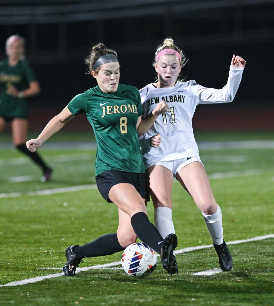 Dublin Jerome’s Megan Michels and New Albany’s Abby Bojko compete during a Division I regional semifinal Nov. 1 at DeSales. Jerome won 2-1, with Michels scoring the second goal for a 2-0 lead on a penalty kick with 12:38 remaining.
