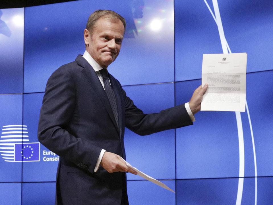 Donald Tusk showing the letter he received signed by Prime Minister Theresa May, which formally notified of the UK's intention to exit the EU (Reuters)