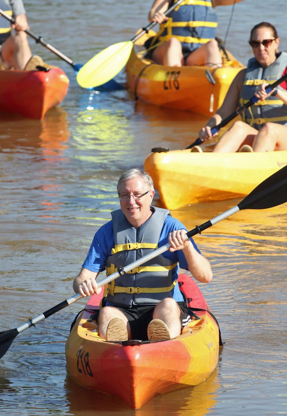 David Wilkes and others in kayaks early Saturday morning, August 5, 2023, on the South Fork River in Cramerton.