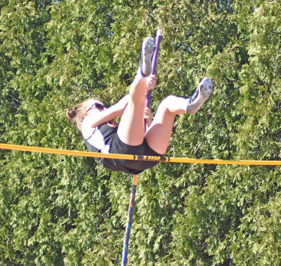 Quincy's Lita Fulton vaults her way to first place in the vault on Friday