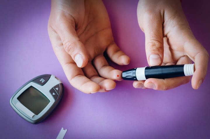 Measuring blood glucose level with a medical device.