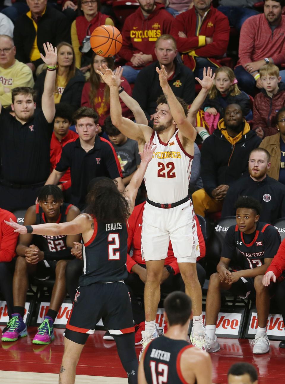 Iowa State University Cyclones guard Gabe Kalscheur (22)takes a 3-point shot over Texas Tech Red Raiders guard Pop Isaacs (2) during a game earlier this season.