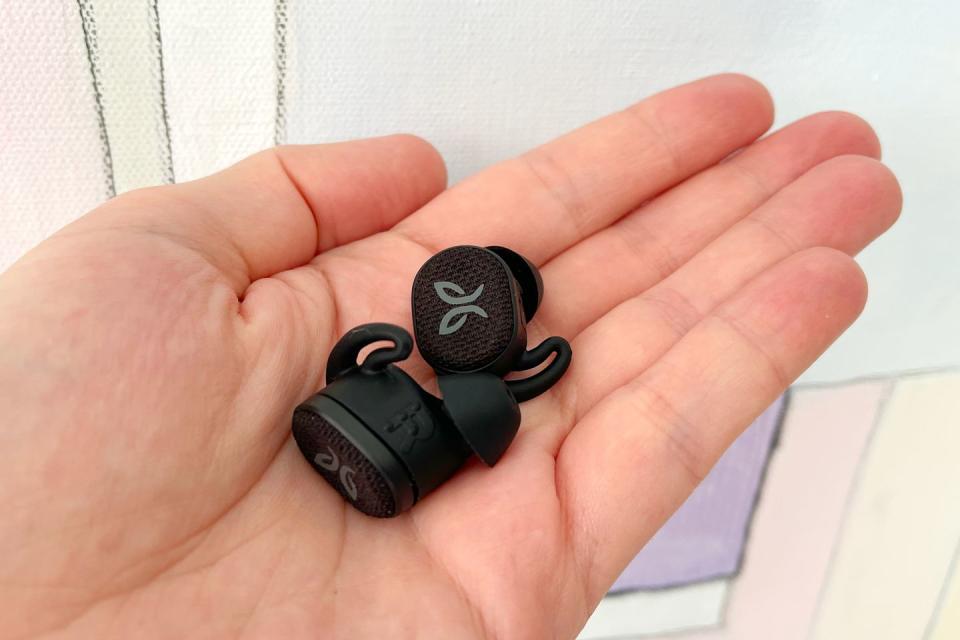 stefan holding jaybird vista 2 earbuds in hand