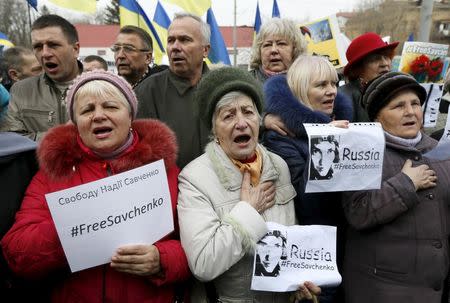 Protesters hold a rally in support of former Ukrainian army pilot Nadezhda Savchenko near the Russian embassy in Kiev, Ukraine, March 9, 2016. REUTERS/Valentyn Ogirenko