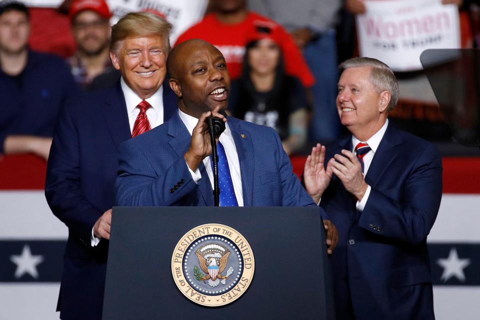 FILE - Sen. Tim Scott, R-S.C., speaks in front of President Donald Trump and Sen. Lindsey Graham, R-S.C., during a campaign rally, Friday, Feb. 28, 2020, in North Charleston, S.C. When Scott launched his campaign for the White House last week, the notoriously prickly former President Donald Trump welcomed his new competitor with open arms. “Good luck to Senator Tim Scott in entering the Republican Presidential Primary Race,” Trump said. (AP Photo/Patrick Semansky, File) ORG XMIT: WX207