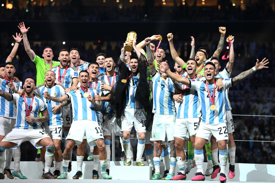 LUSAIL CITY, QATAR - DECEMBER 18: Lionel Messi of Argentina lifts the FIFA World Cup Qatar 2022 Winner's Trophy during the FIFA World Cup Qatar 2022 Final match between Argentina and France at Lusail Stadium on December 18, 2022 in Lusail City, Qatar. (Photo by Michael Regan - FIFA/FIFA via Getty Images)