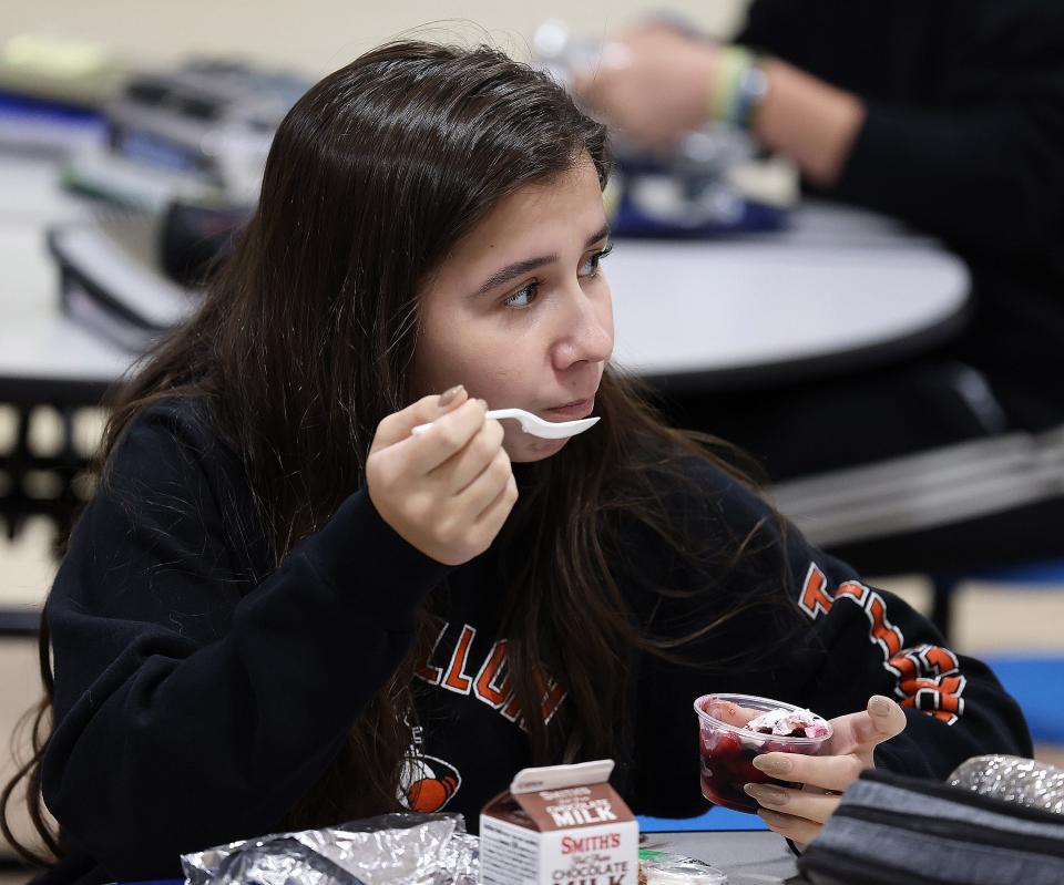 Tuslaw High School junior Claire Baker has lunch in the school cafeteria. Tuslaw and other Stark districts are finding it difficult to get some food items.