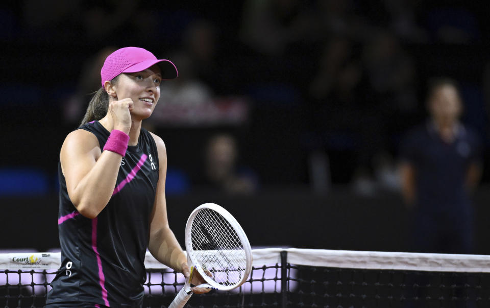 Poland's Iga Swiatek celebrates defeating Belgium's Elise Mertens after the women's singles round of 16 tennis match at the WTA Tour in Stuttgart, Germany, Thursday April 18, 2024. (Marijan Murat/ after her victory. Photo: Marijan Murat/dpa via AP)