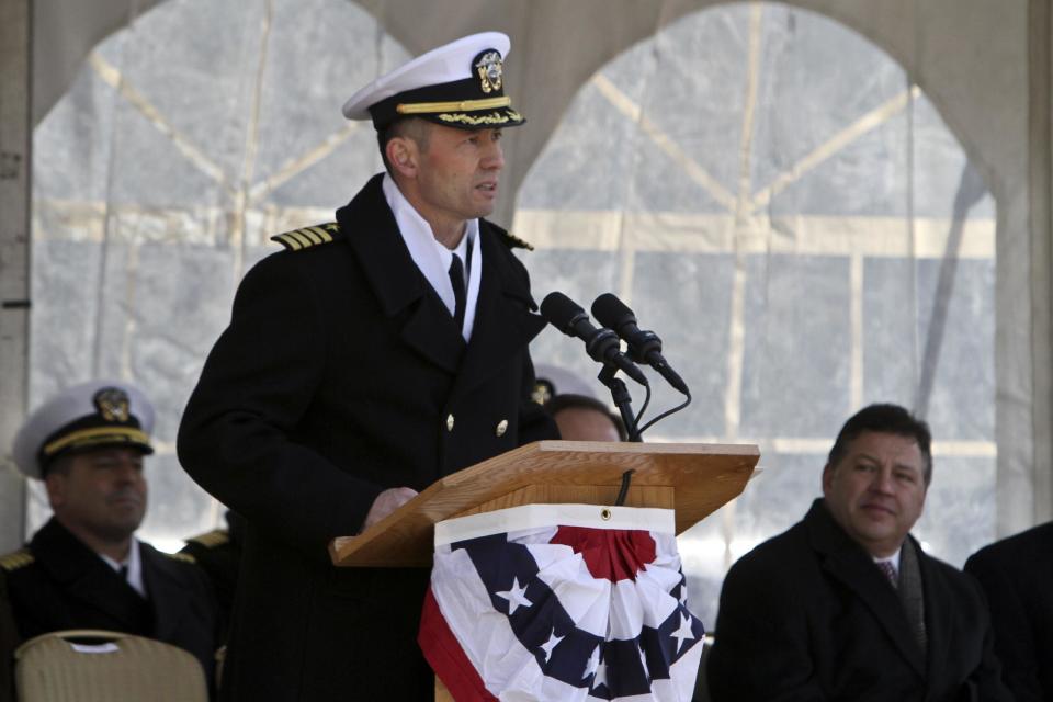 Commanding Officer Capt. Thomas Dearborn speaks during a commissioning ceremony for the USS Somerset (LPD 25) Saturday, March 1, 2014, in Philadelphia. The USS Somerset is the ninth San Antonio-class amphibious transport dock and the third of three ships named in honor of those victims and first responders of the attacks on the World Trade Center and the Pentagon. The ship is named for the county where Flight 93 crashed after being hijacked on Sept. 11, 2001. (AP Photo/ Joseph Kaczmarek)