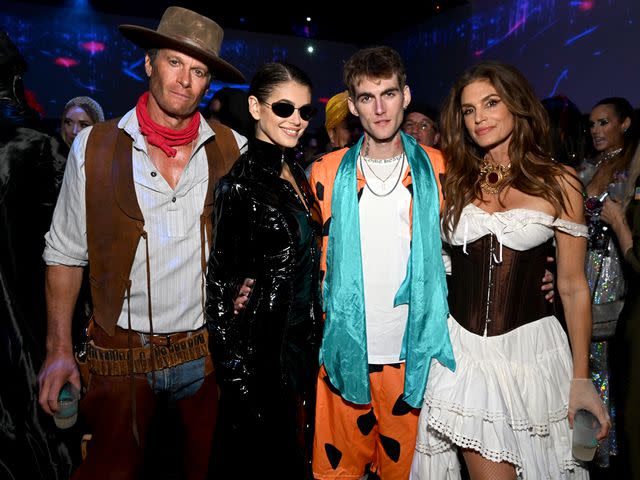 <p>Michael Kovac/Getty</p> Rande Gerber, Kaia Jordan Gerber, Presley Walker Gerber and Cindy Crawford attend the Casamigos Halloween Party in 2022