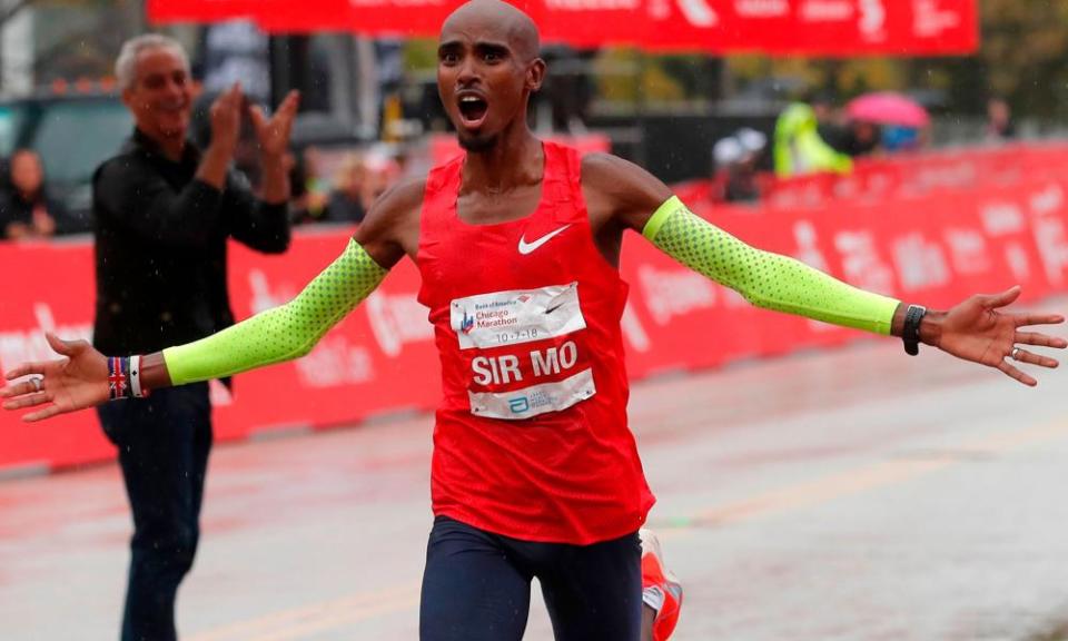 Mo Farah celebrates as he crosses the finish line to win the Chicago marathon in October.