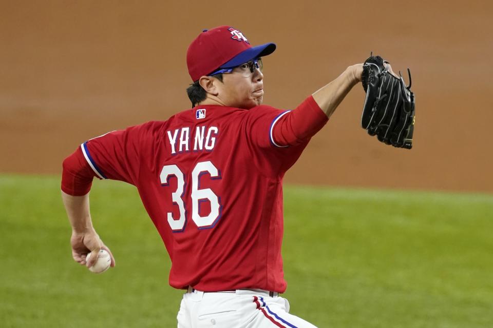 Texas Rangers relief pitcher Hyeon-Jong Yang throws to a Boston Red Sox batter during the third inning of a baseball game in Arlington, Texas, Friday, April 30, 2021. (AP Photo/Tony Gutierrez)