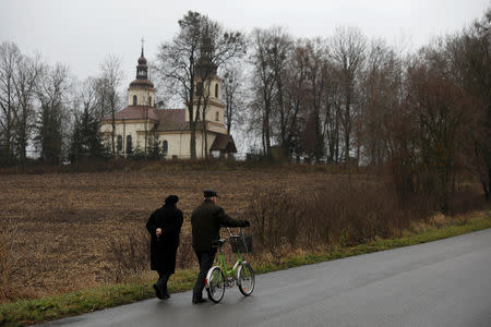 People go to a mass in Kalinowka, Poland November 25, 2018. REUTERS/Kacper Pempel/Files