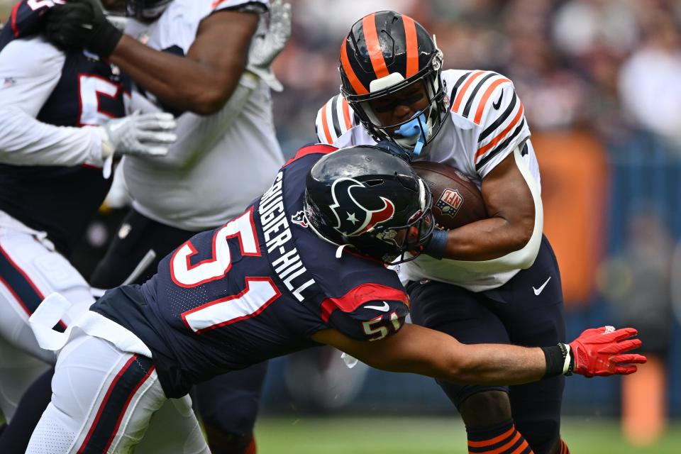 Bears running back Khalil Herbert is tackled by Texans linebacker Kamu Grugier-Hill (51) in the first quarter, Sept. 25, 2022, in Chicago.