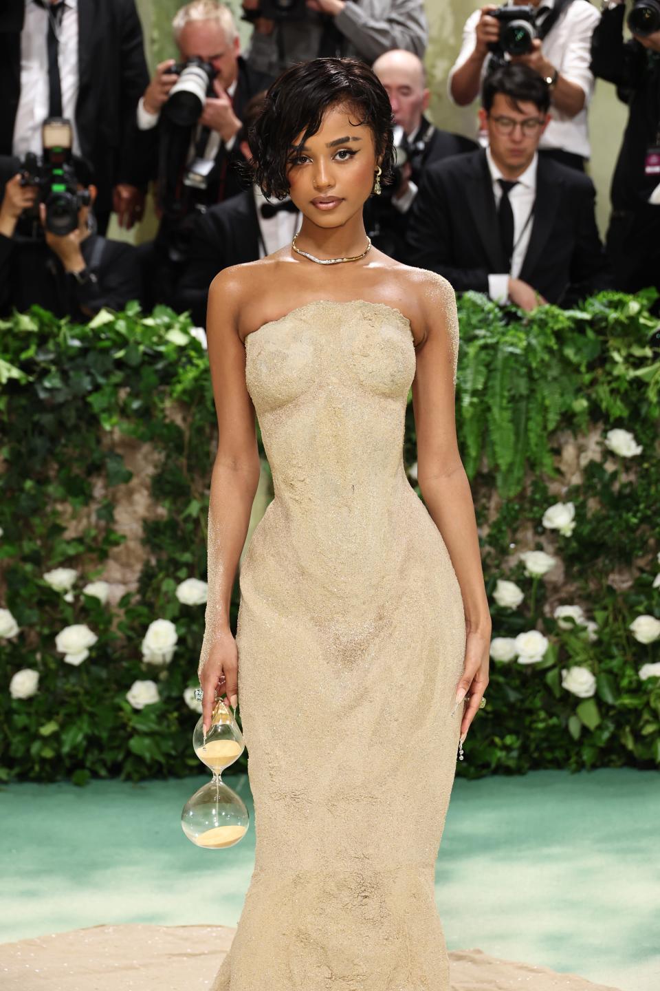 Tyla nodded to the “time” element of the show with her Balmain gown, which was actually made from sand. (Get it? Sands of time?) Don't miss the hourglass bag!