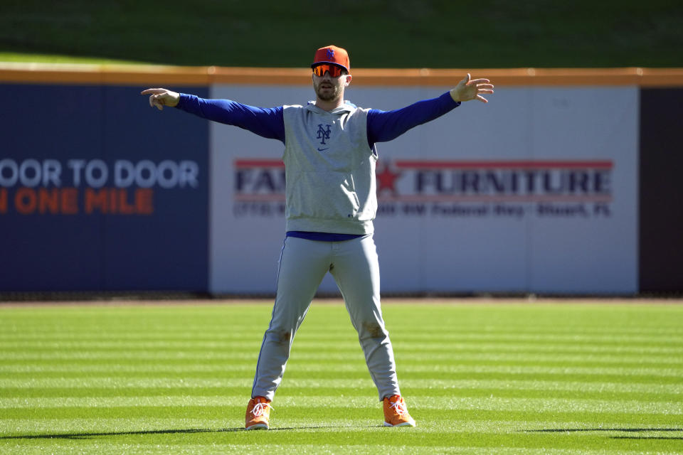 New York Mets' Pete Alonso stretches during a spring training baseball workout Tuesday, Feb. 20, 2024, in Port St. Lucie, Fla. (AP Photo/Jeff Roberson)
