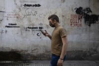 Anti-Turkish graffiti adorns a wall in the main Armenian district of the northern Beirut suburb of Bourj Hammoud, Lebanon, Tuesday, Oct. 6, 2020. In Bourj Hammoud anger and anxiety are clear among the population over the fighting between Armenian and Azerbaijani forces in the separatist region of Nagorno-Karabakh that broke out on Sept. 27 and has left dozens killed since then. Armenian language graffiti reads, "Courage, top, and the spirit of resistance, bottom right." (AP Photo/Hassan Ammar)