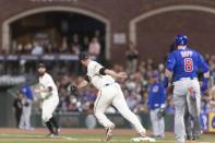 Jul 9, 2018; San Francisco, CA, USA; San Francisco Giants relief pitcher Tony Watson (56) forces out Chicago Cubs left fielder Ian Happ (8) at first base during the seventh inning at AT&T Park. Mandatory Credit: Neville E. Guard-USA TODAY Sports