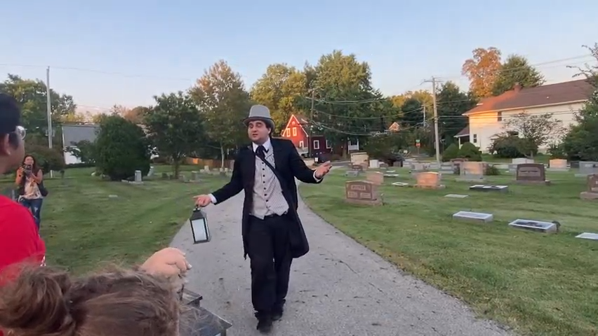Jesse Pimpinella leads at Ghost Story Tour, sponsored by Uptown Westerville Inc. and Good Medicine Production, spinning tales about grave robbery in the Otterbein Cemetery.