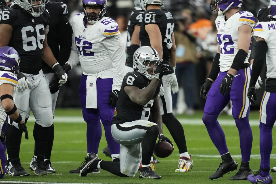 Las Vegas Raiders running back Josh Jacobs (8) celebrate a first down against the Minnesota Vikings during the first half of an NFL football game, Sunday, Dec. 10, 2023, in Las Vegas. (AP Photo/John Locher)