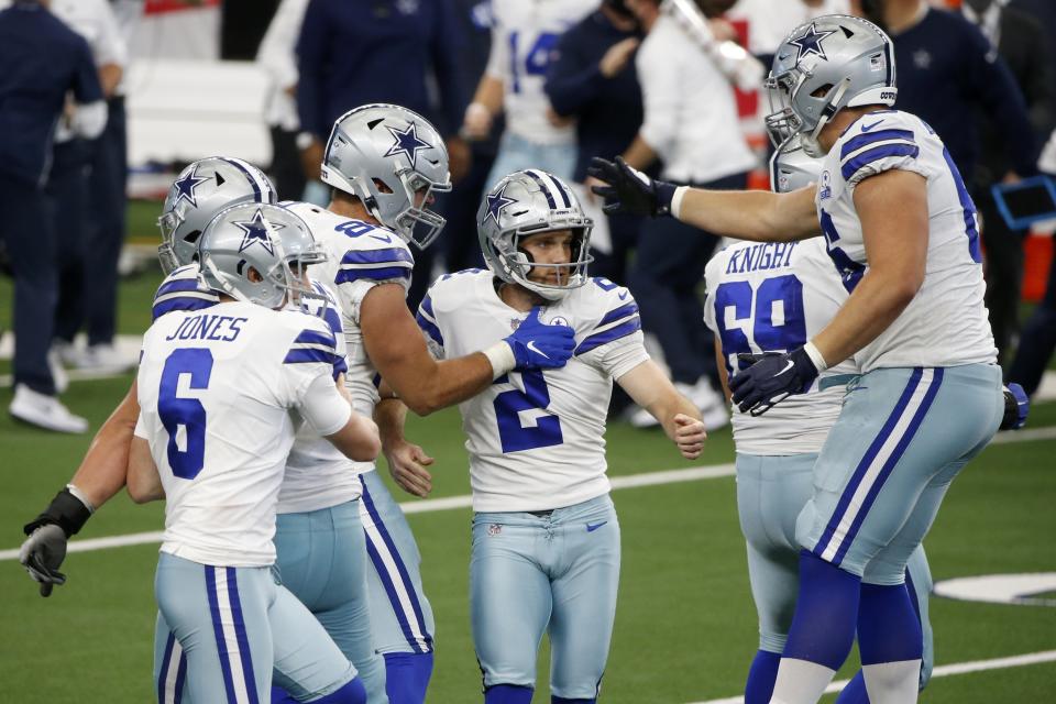 Dallas Cowboys' Chris Jones (6) and others celebrate with kicker Greg Zuerlein (2) after Zuerlein kicked a field goal to help the Cowboys to a 40-39 win against the Atlanta Falcons in an NFL football game in Arlington, Texas, Sunday, Sept. 20, 2020. (AP Photo/Michael Ainsworth)