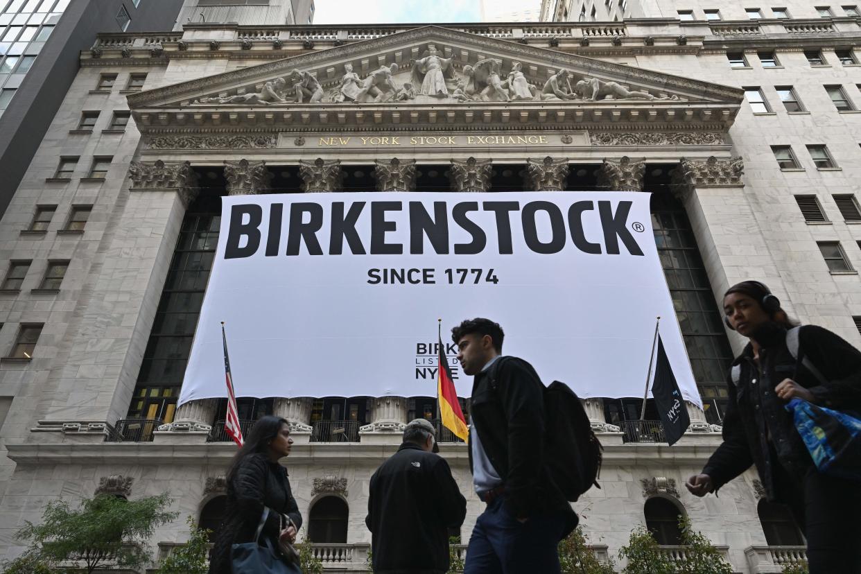 A Birkenstock banner hangs outside the New York Stock Exchange (NYSE) in New York on October 11, 2023, as Birkenstock launches an Initial Public Offering (IPO). German sandals maker Birkenstock's IPO launch values the company at $8.6 billion, according to multiple media reports. (Photo by ANGELA WEISS / AFP) (Photo by ANGELA WEISS/AFP via Getty Images)