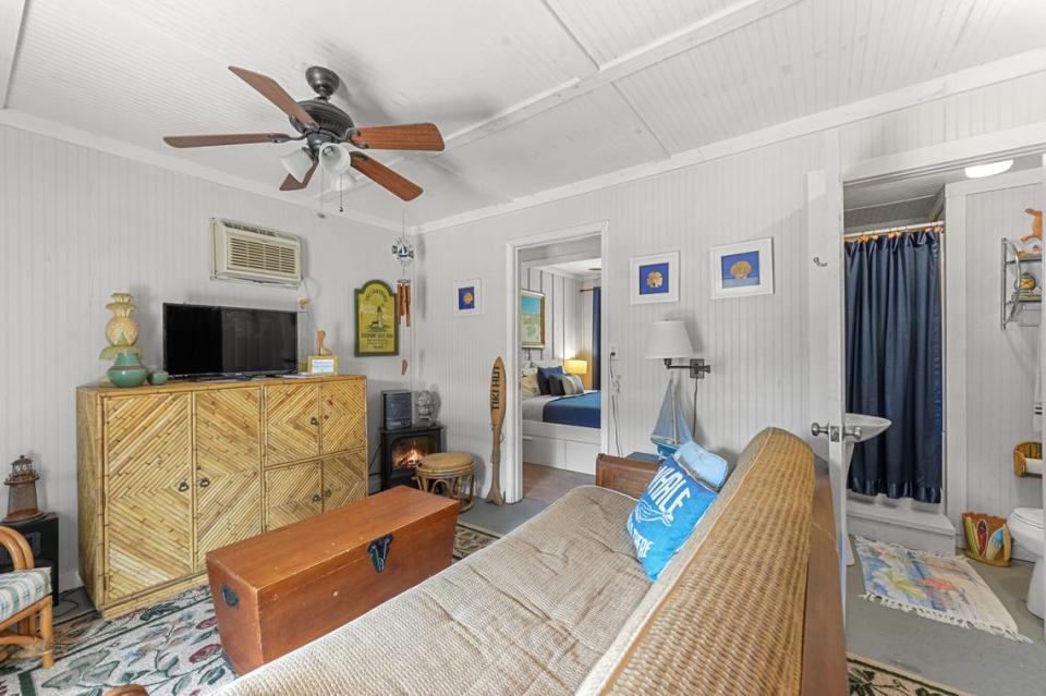 A futon folds out into a bed in the living room of the downstairs apartment on the Breezy Porches property in Waveland. MS Real Estate Photography