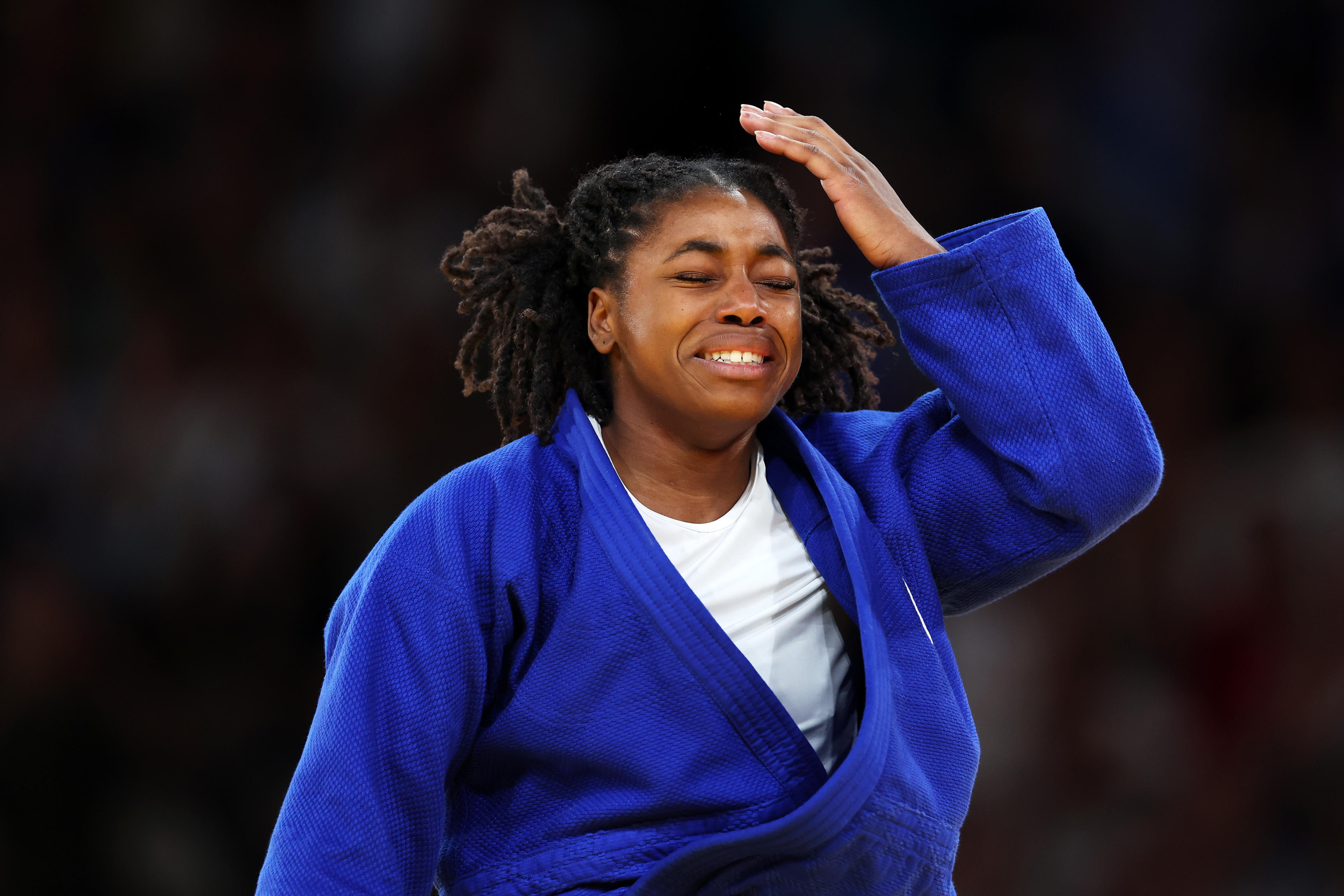 PARIS, FRANCE - JULY 29: Sarah Leonie Cysique of Team France celebrates winning bronze against Eteri Liparteliani of Team Georgia following the Judo Women's -57 kg Bronze Medal contest on day three of the Olympic Games Paris 2024 at Champs-de-Mars Arena on July 29, 2024 in Paris, France. (Photo by Alex Pantling/Getty Images)