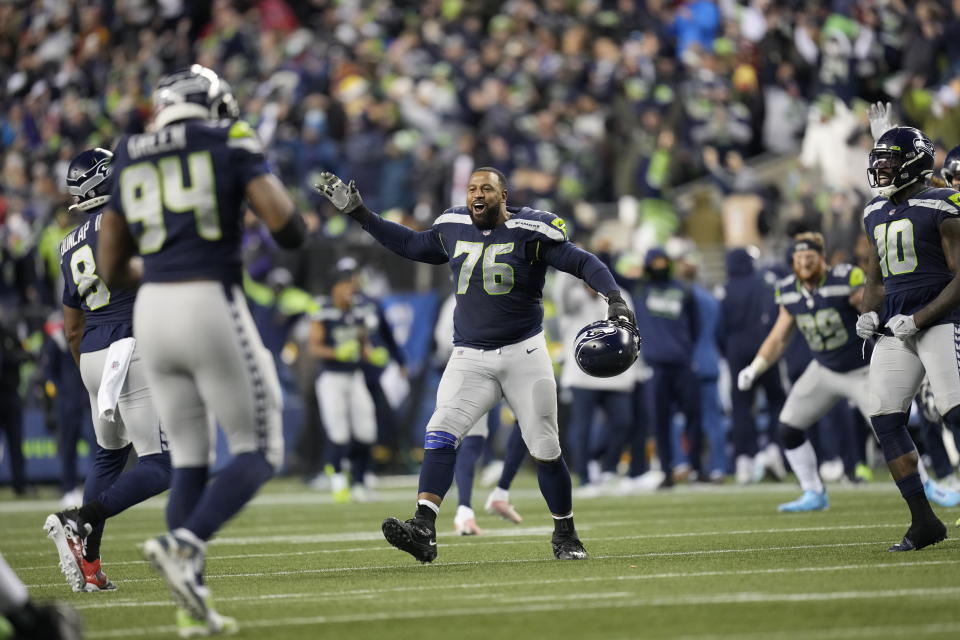 Seattle Seahawks offensive tackle Duane Brown celebrates the win after an NFL football game against the San Francisco 49ers, Sunday, Dec. 5, 2021, in Seattle. The Seahawks won 30-23. (AP Photo/Ben VanHouten)