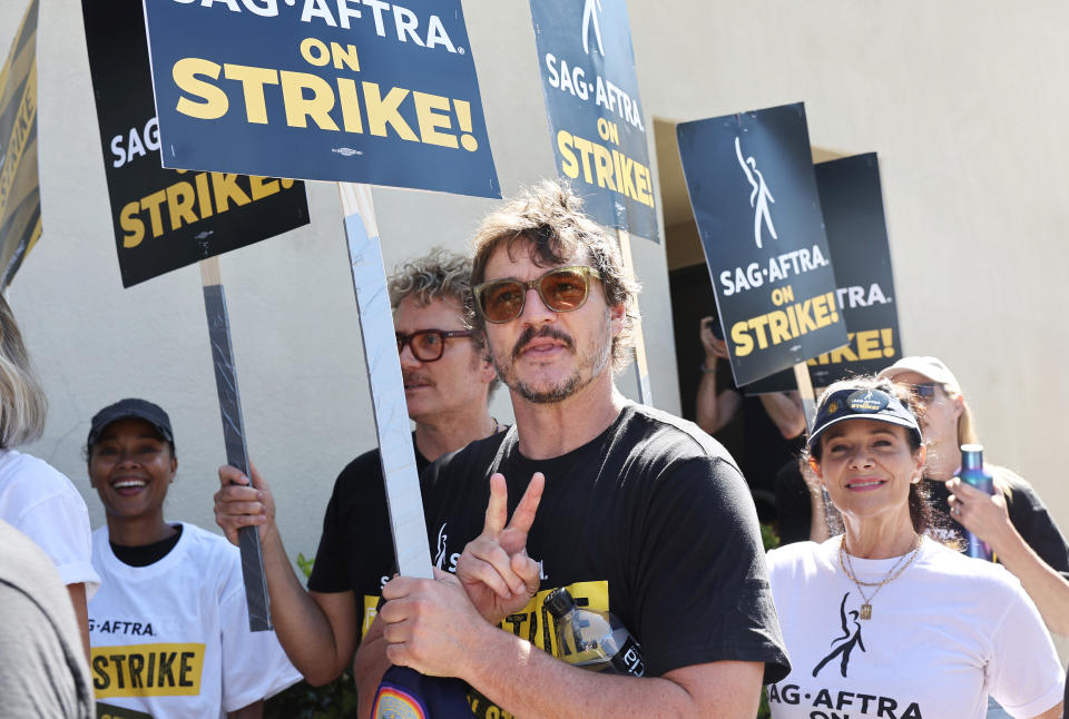 BURBANK, CALIFORNIA – SEPTEMBER 26: Pedro Pascal (C) walks the picket line with striking SAG-AFTRA members outside Warner Bros. Studio. Photo by Mario Tama/Getty Images