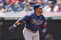 Tampa Bay Rays' Nelson Cruz watches his solo home run in the sixth inning of a baseball game against the Cleveland Indians, Sunday, July 25, 2021, in Cleveland. (AP Photo/Tony Dejak)