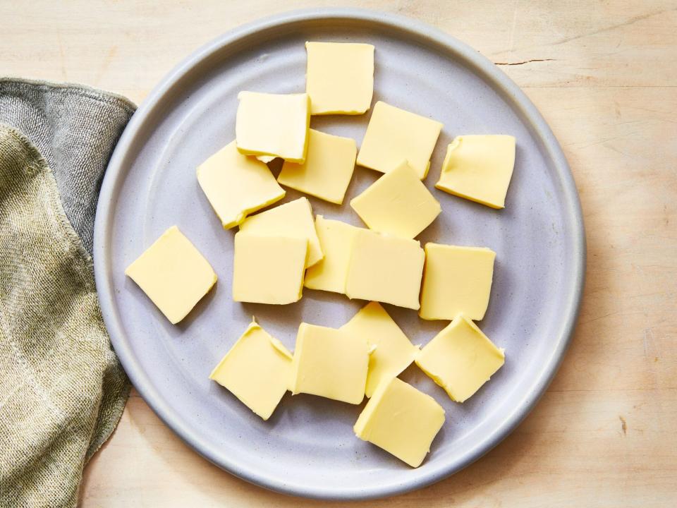 softened butter cubes on a plate