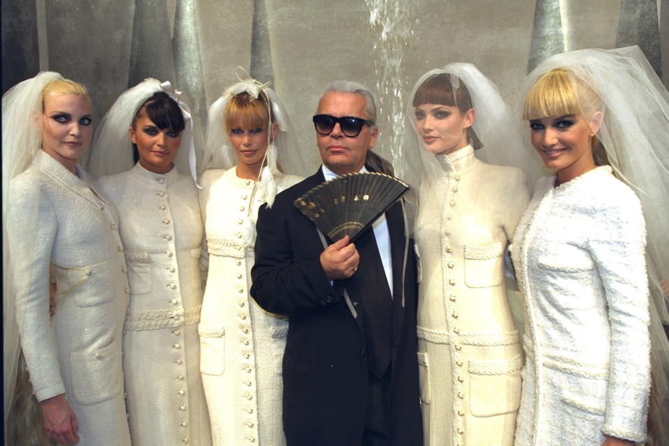 Lagerfeld with models during Chanel's fall/winter 1995 couture show.&nbsp;