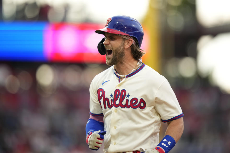 Philadelphia Phillies' Bryce Harper reacts after hitting a run-scoring single during the 10th inning of a baseball game against the San Diego Padres, Sunday, July 16, 2023, in Philadelphia. (AP Photo/Matt Slocum)