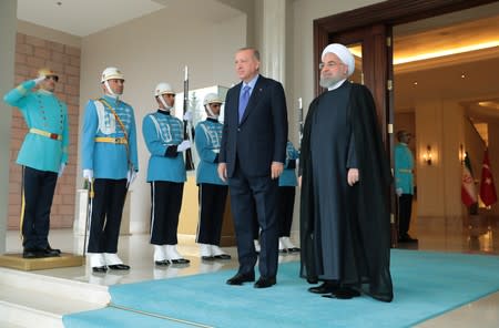Turkish President Erdogan welcomes his Iranian counterpart Rouhani before their meeting in Ankara
