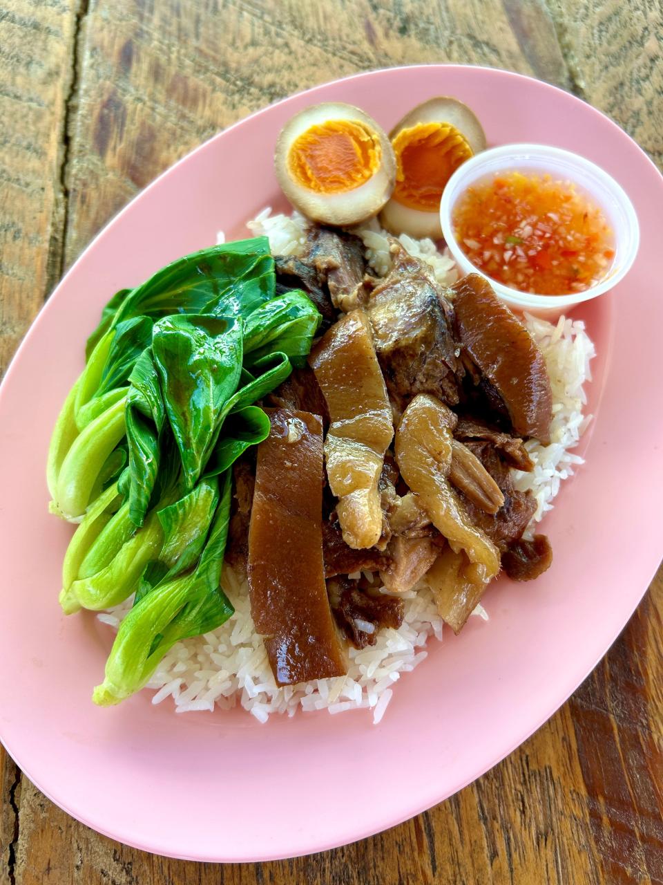 Cassia's menu features Kao Ka Moo, soy-braised pork shanks with bok choi, egg and jasmine rice.